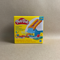 Play-Doh packaging on a beige background