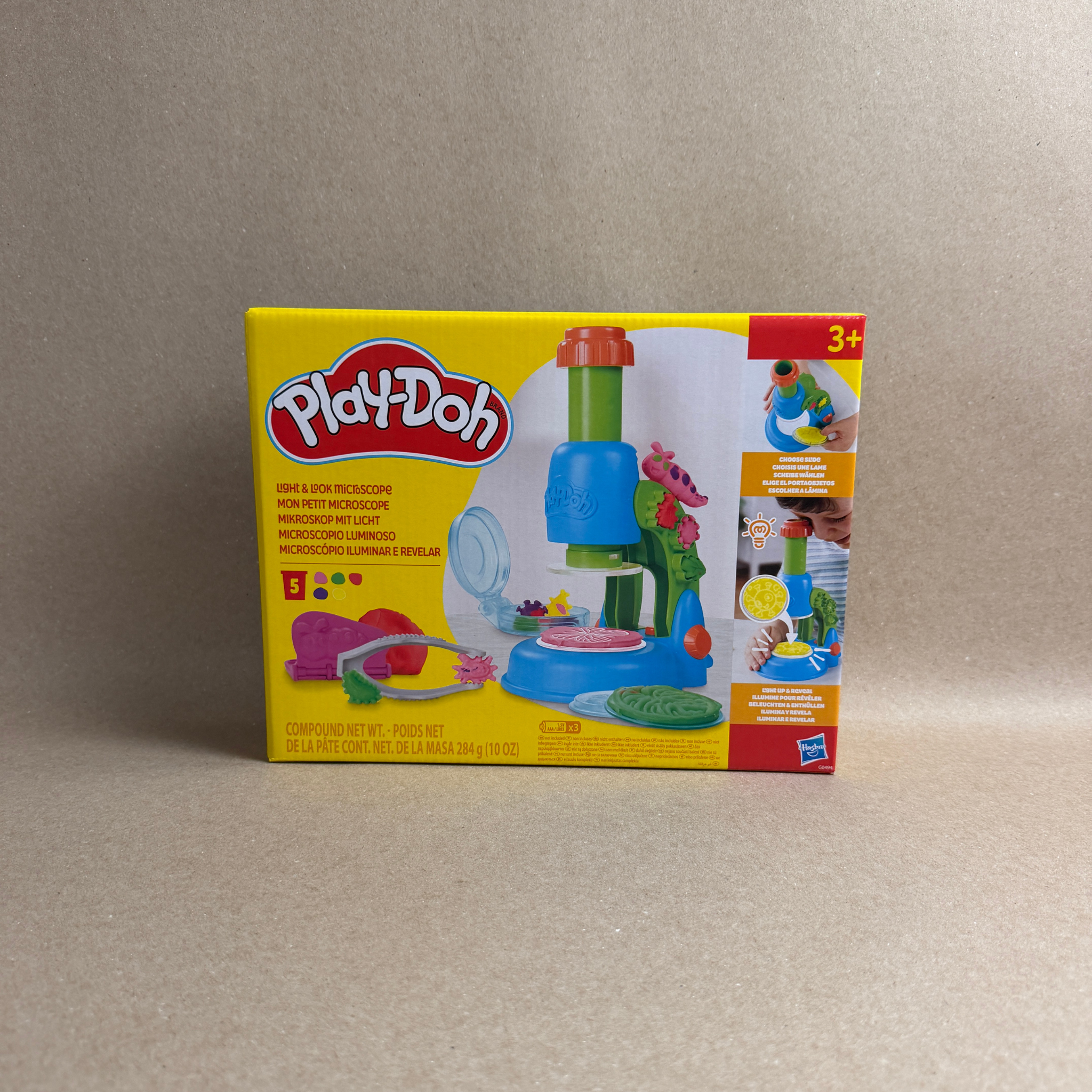 Play-Doh toy set packaging on a beige background