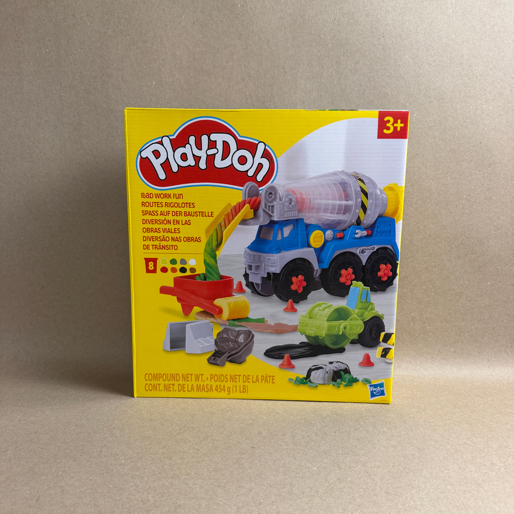 Play-Doh toy set packaging with a cement mixer toy on a beige background