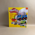 Play-Doh toy set packaging with a cement mixer toy on a beige background