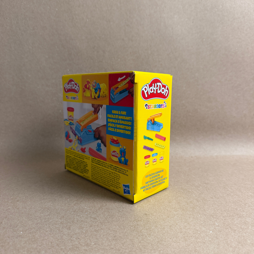 Play-Doh packaging on a beige background