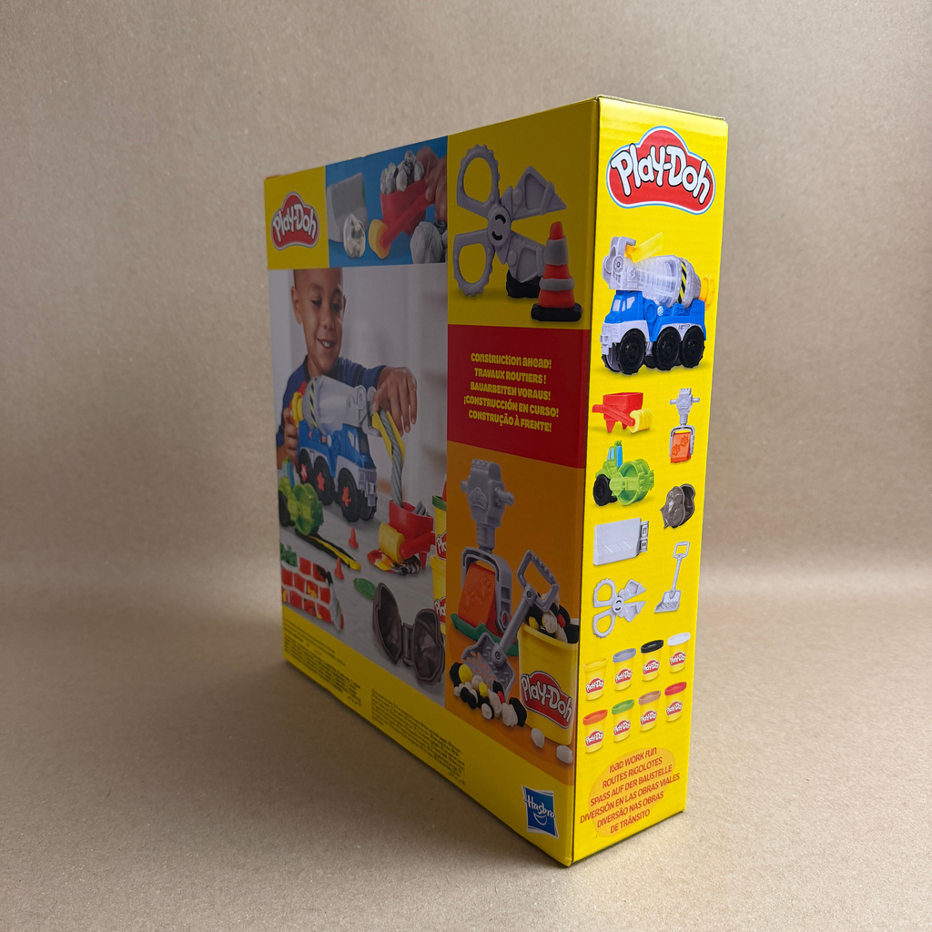 Play-Doh toy set packaging with images of children playing and toy vehicles on a beige background