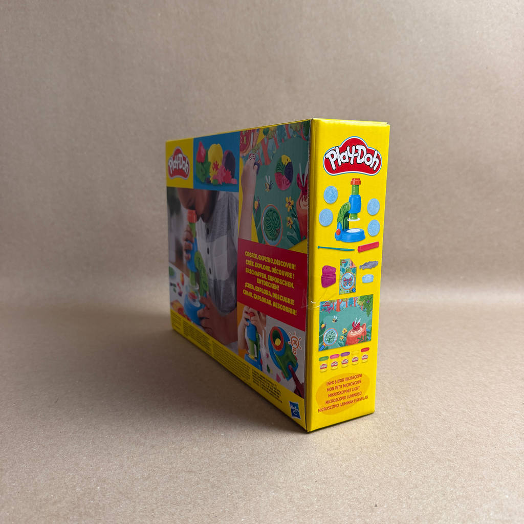 Play-Doh packaging on a beige background
