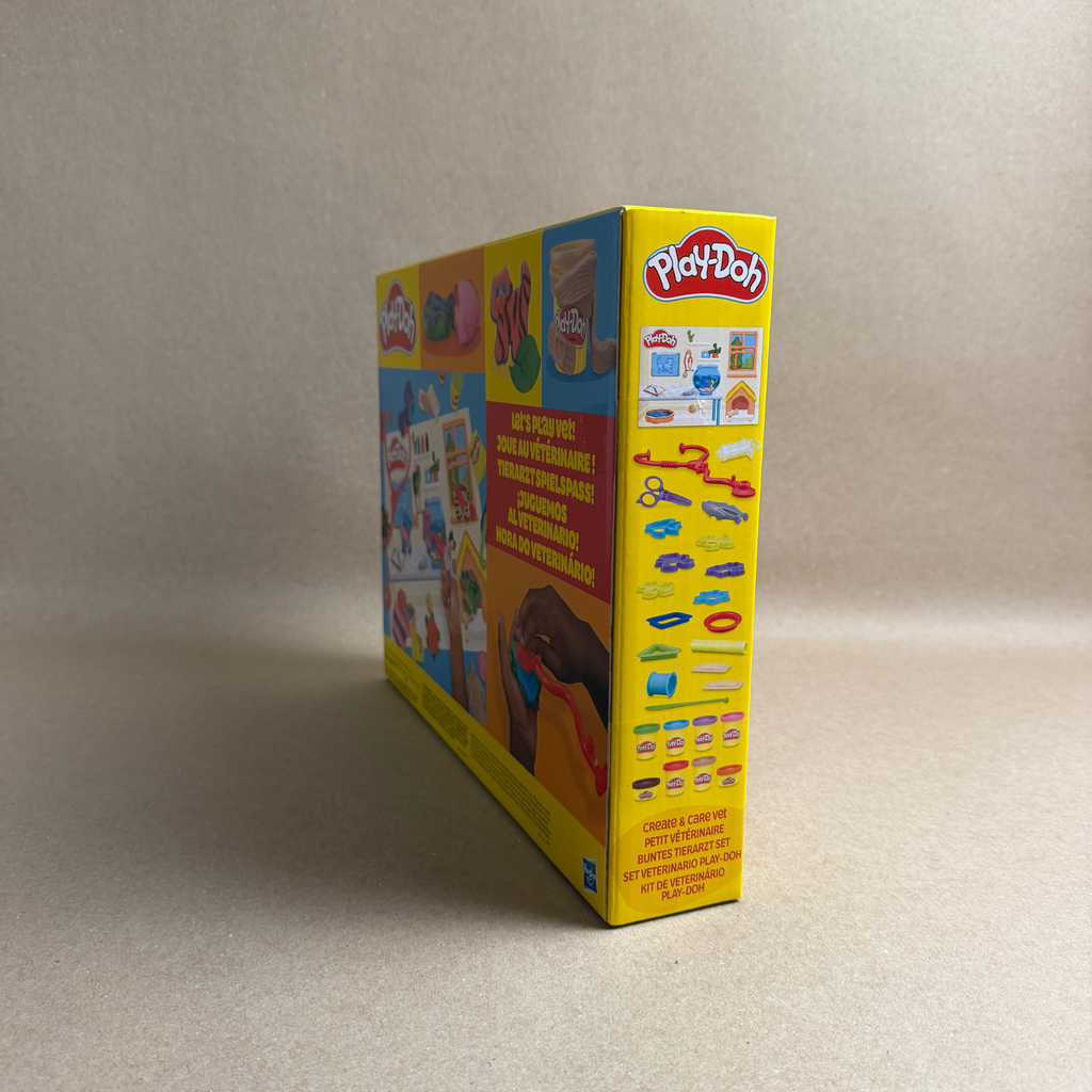 Play-Doh box with colorful design on a beige background