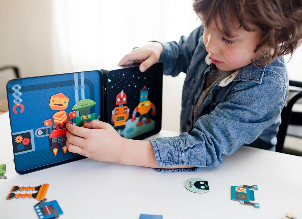 Child playing with colorful robot magnetic puzzle toy for creative play and learning