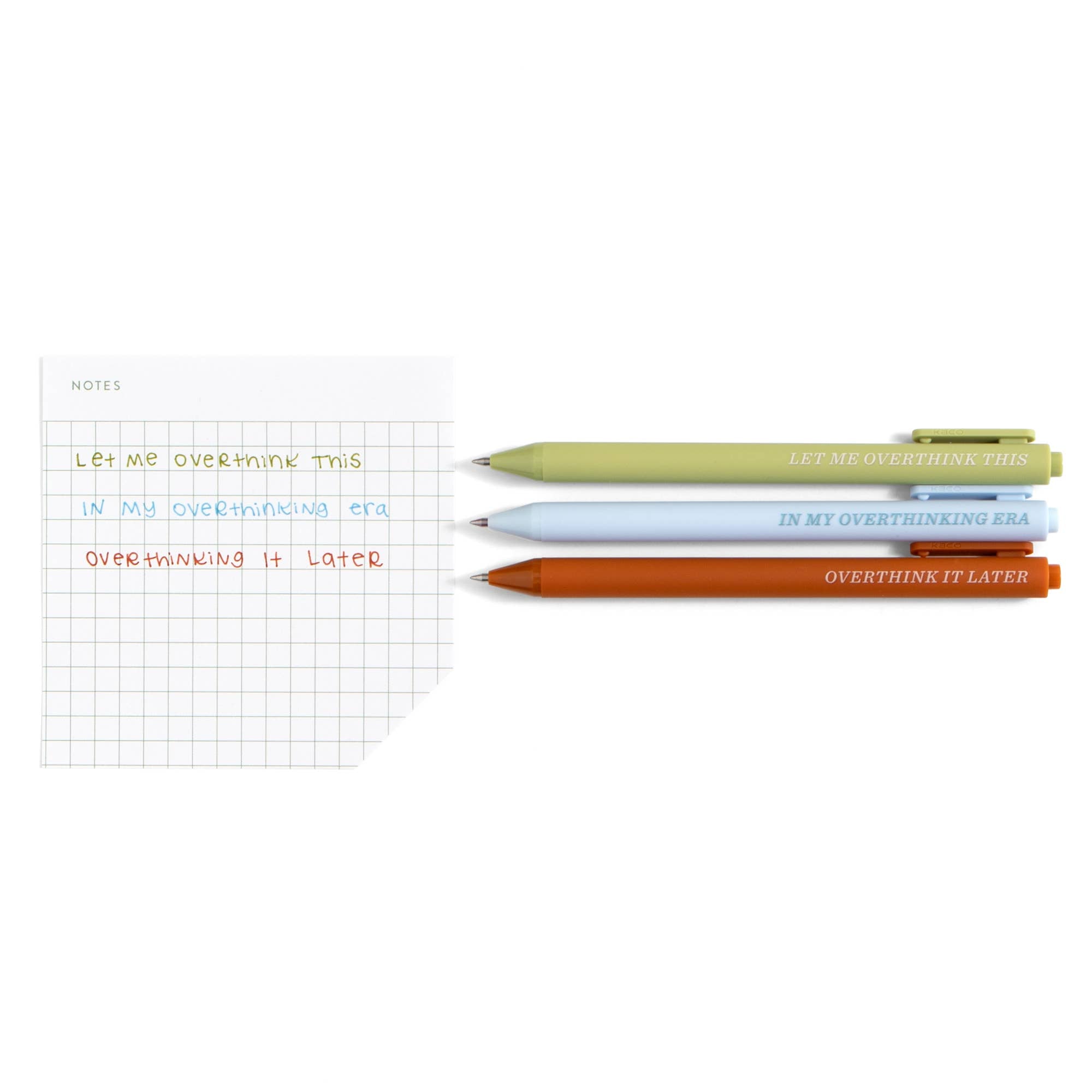 Three colorful pens with 'Overthink' quotes beside a grid notebook, perfect for planners and intentional journaling.