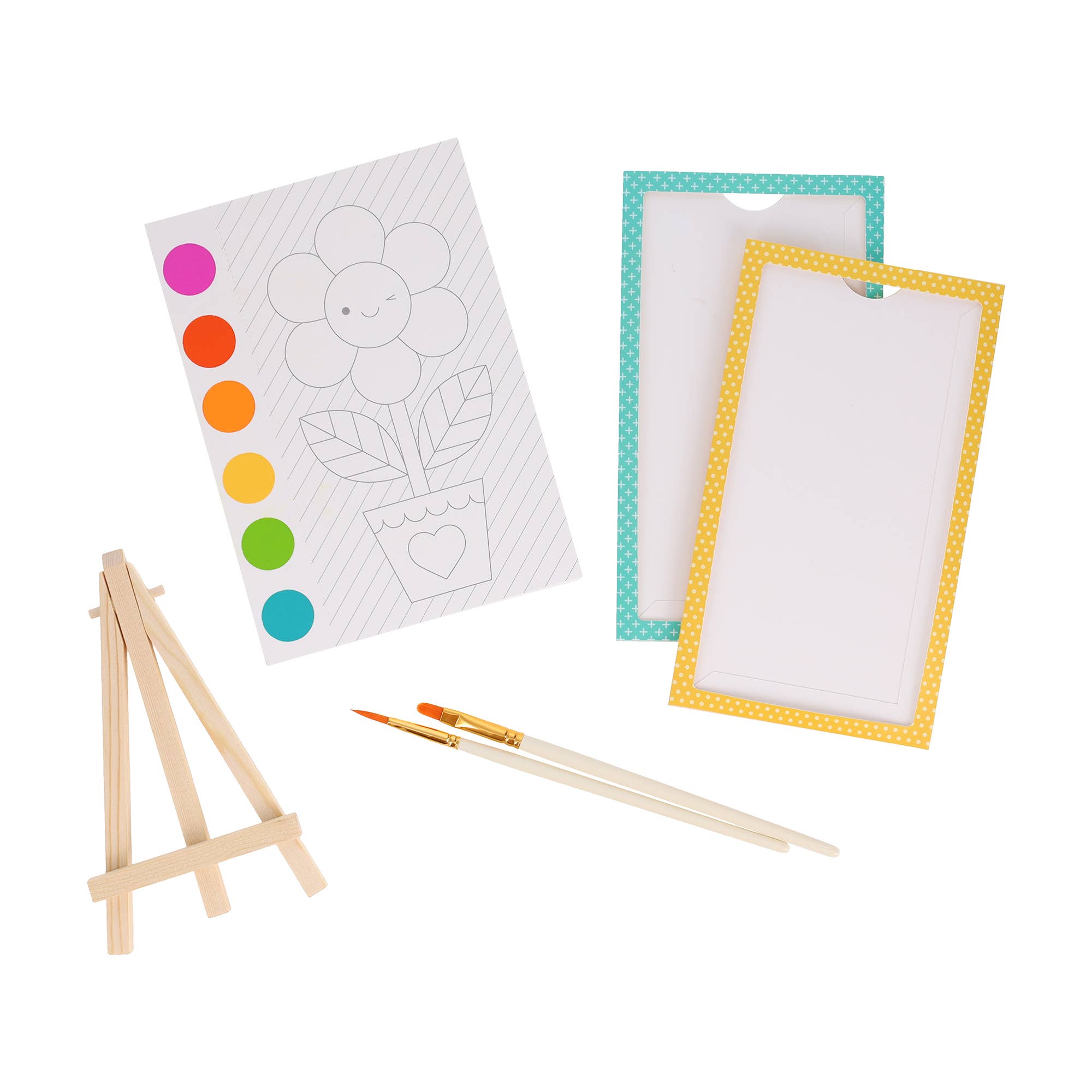 Artistic set with coloring book, paintbrushes, and easel on a white background
