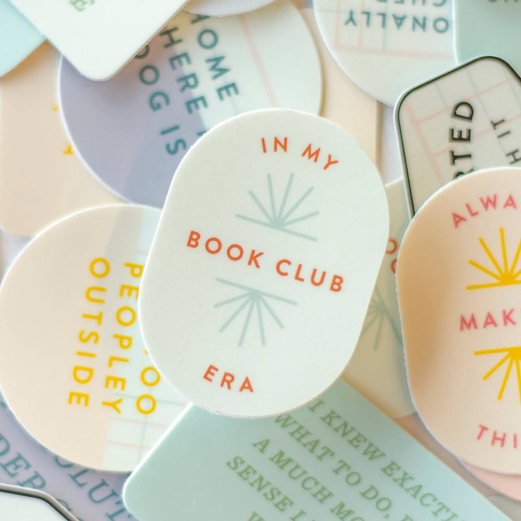 Round ceramic plates with text and sun designs on a surface.
