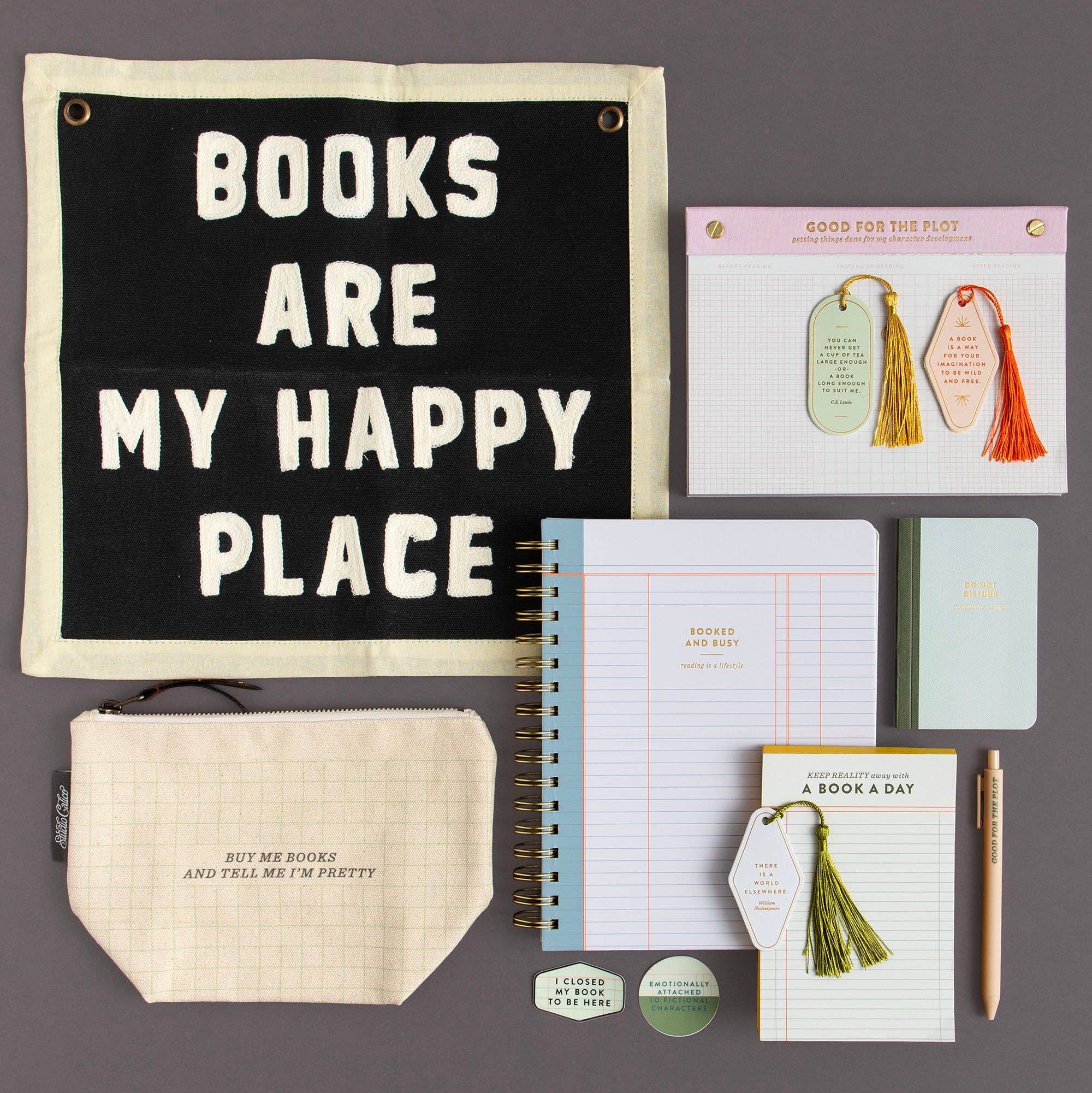 Books are my happy place banner with planners, bookmarks, and cozy reading accessories for book lovers.