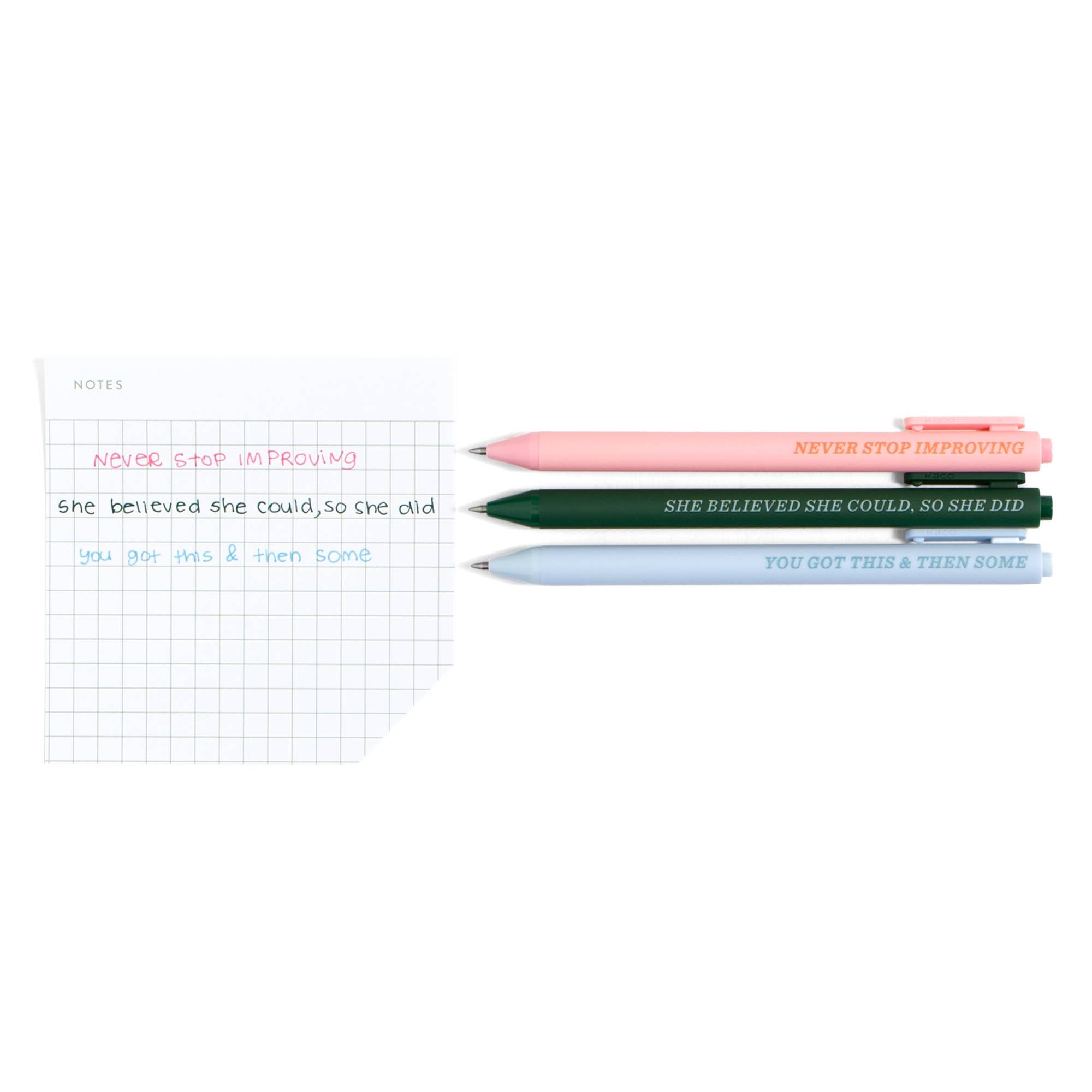 Motivational pens with quotes like 'Never Stop Improving' beside grid notebook for planners and journaling