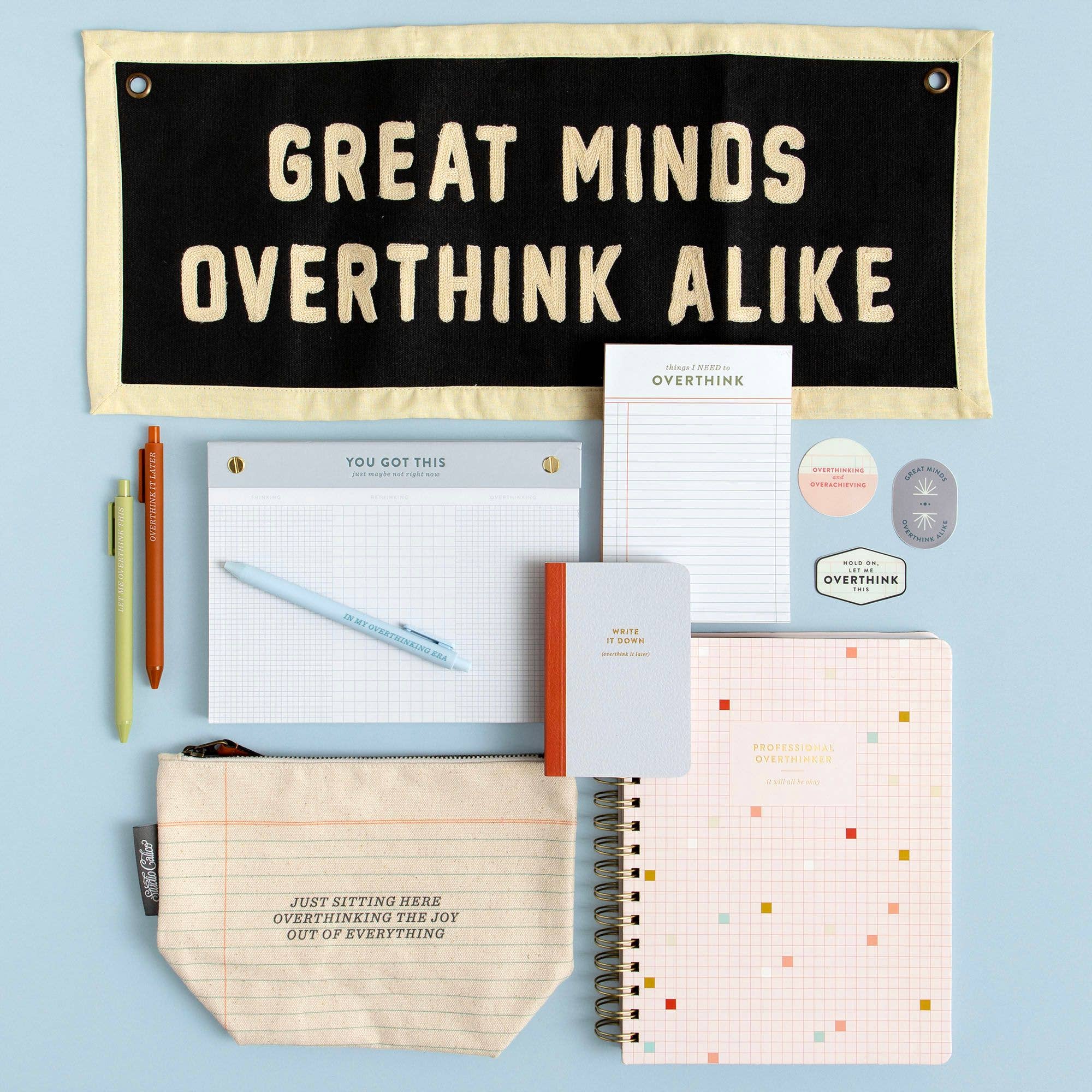 Collection of stationery items with a motivational banner on a light blue background