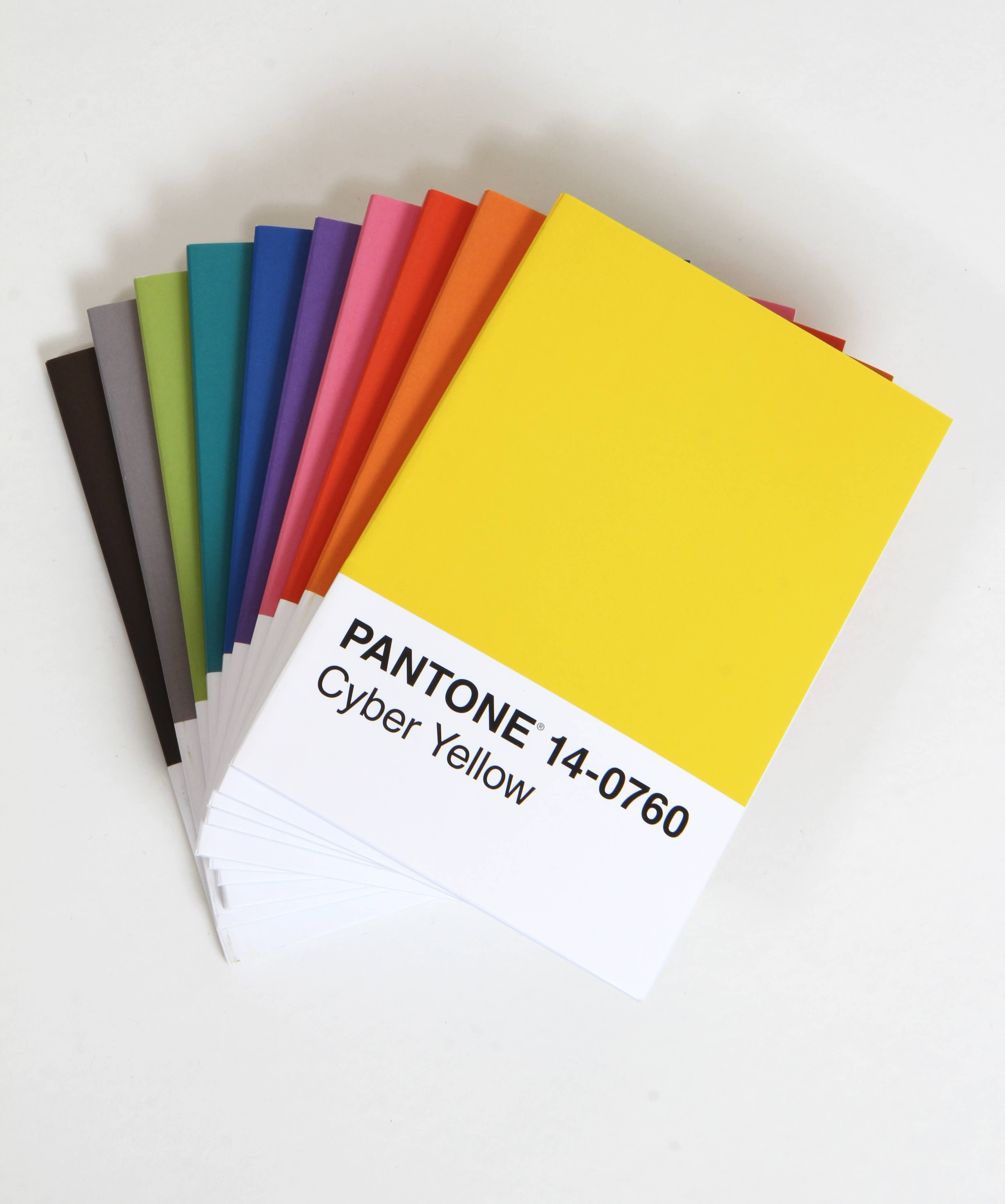 Pantone Cyber Yellow 14-0760 color swatch among vibrant rainbow hues for creative planning and design