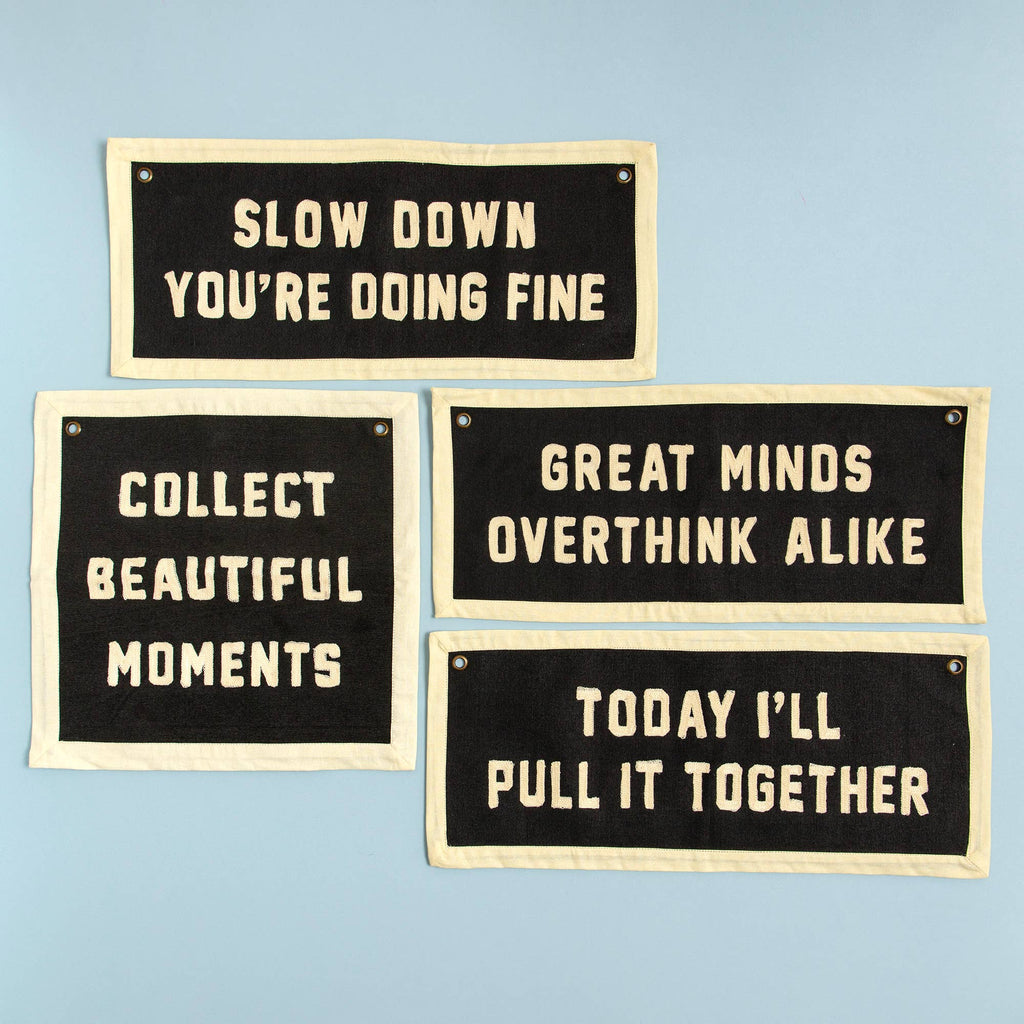 Set of four motivational fabric signs with phrases like 'Slow Down You're Doing Fine' and 'Collect Beautiful Moments' for cozy home decor.