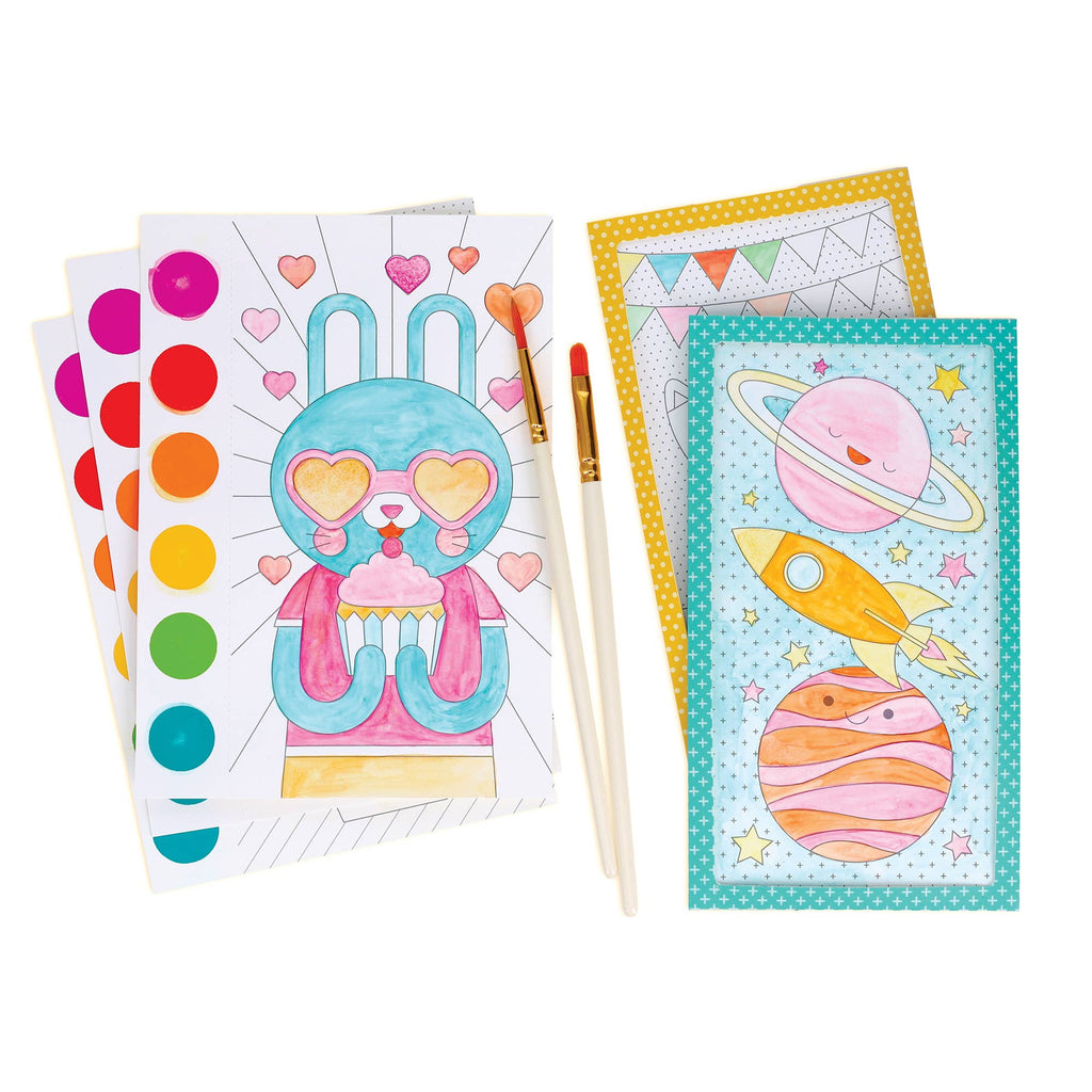 Coloring books with space-themed designs and paintbrushes on a white background