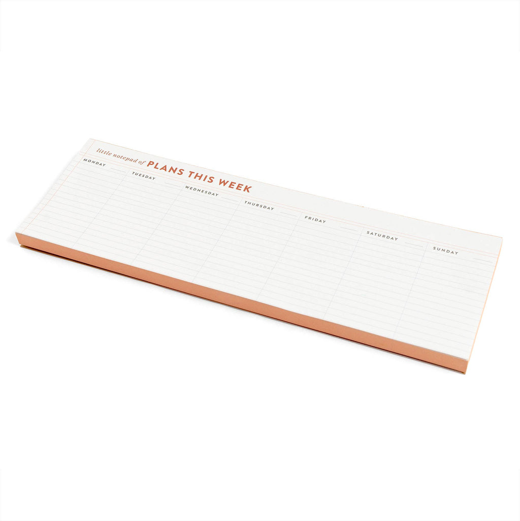 Weekly planner pad with 'Plans This Week' text on a white background